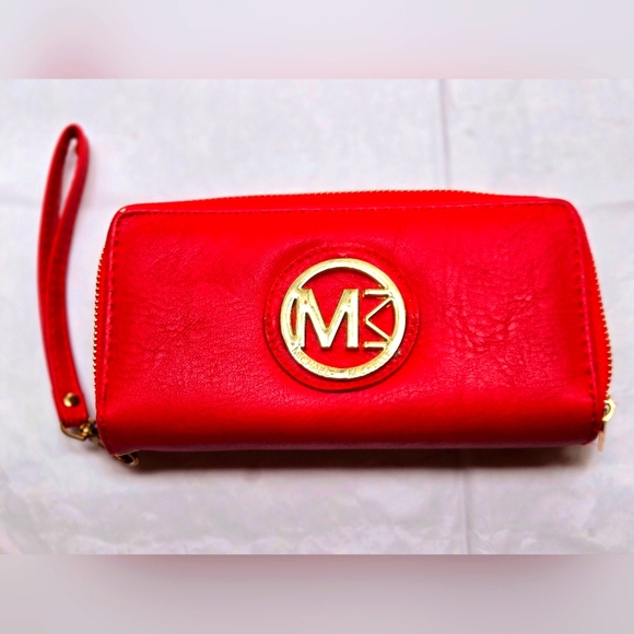 Red wallet with 2 zipper compartments and a wrist handle. - Picture 1 of 12
